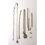 An assortment of 9ct gold and yellow metal items to include chains, bracelets, pendants etc.