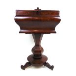 A William IV mahogany teapoy of sarcophagus form with bombe sides over a shaped hexagonal column,