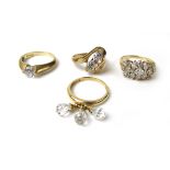 Four assorted 14ct gold, CZ and crystal dress rings. Approx weight 15.