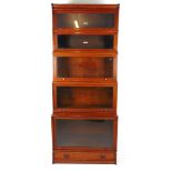 An early 20th century walnut Globe Wernicke and other sectional bookcase including plinth section