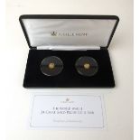 A commemorative 24ct gold WWII commemorative coin pair.