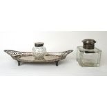 A Victorian silver inkstand having a pierced border and a cut glass inkwell,