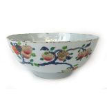 An 18th century Chinese export porcelain bowl decorated in blue, red and green enamels with fruit,