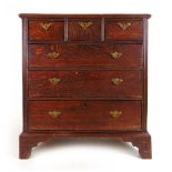 An 18th century oak chest of three short over three long drawers on bracket feet, h. 98 cm, w.