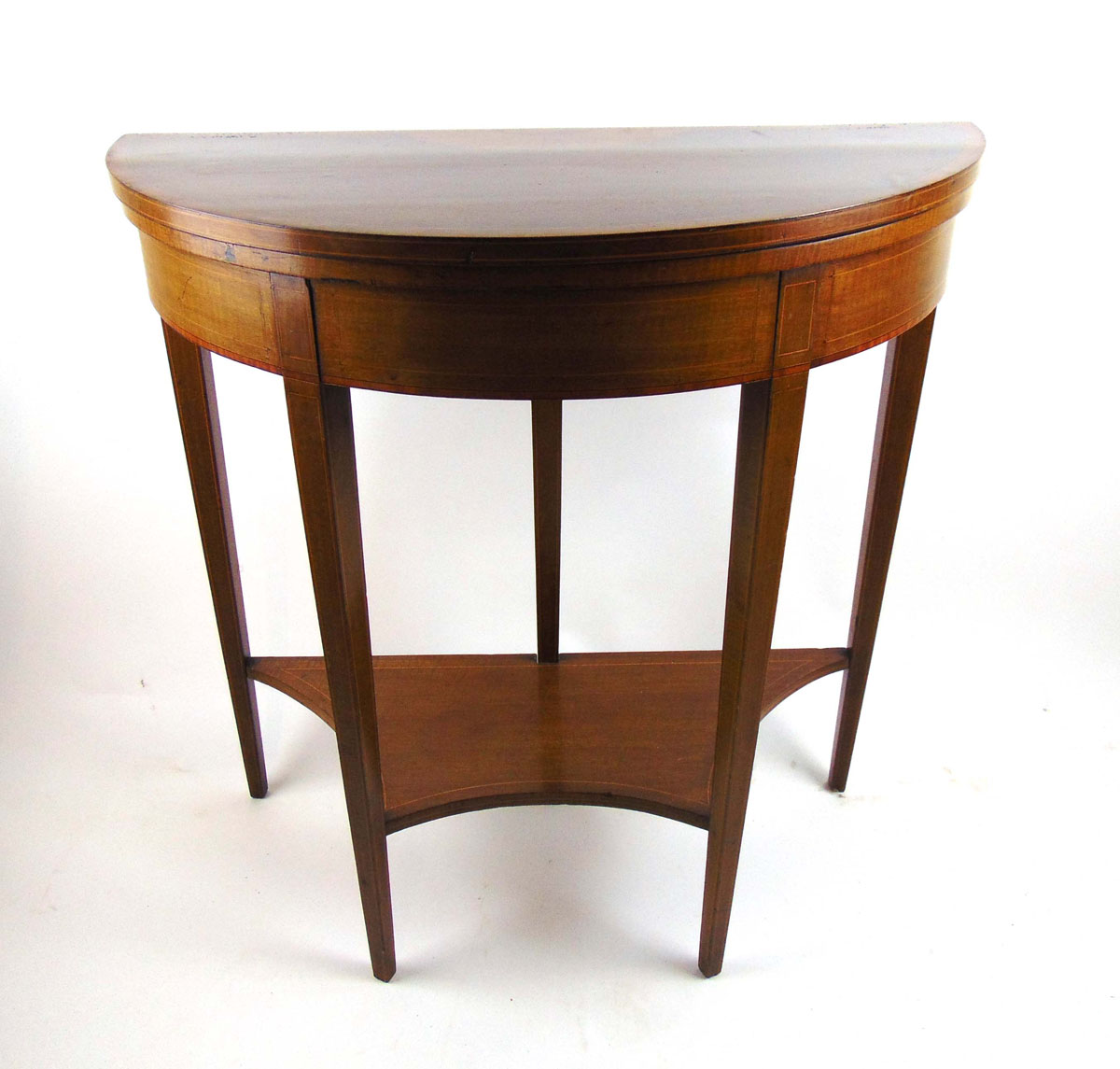 An Edwardian mahogany, satinwood banded, strung and marquetry games table,