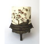 A Japanese Meiji period carved ivory and shibyama inlaid vase on a lacquered and painted stand.