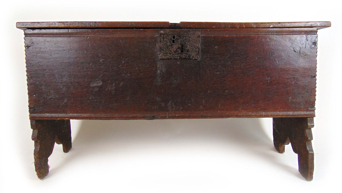 A late 17th century oak six plank coffer, the top lifting to reveal a vacant interior, h. 62 cm, w.