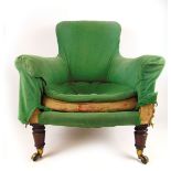 A 19th century Howard and son's style armchair on turned mahogany front legs with Cope's patent