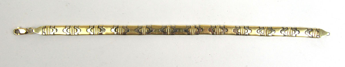 A yellow metal flat-link bracelet. Approx weight 22.