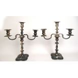 A pair of Elizabeth II silver rococo style two branch candelabra.