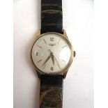 A gentleman's 9ct gold cased Longines wristwatch having Arabic numerals and baton markers to dial