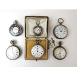 An assortment of pocket watches to include three silver cased watches and a pocket chronograph