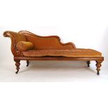 A Victorian mahogany chaise longue upholstered in a cut peach/gold fabric on turned legs, h.