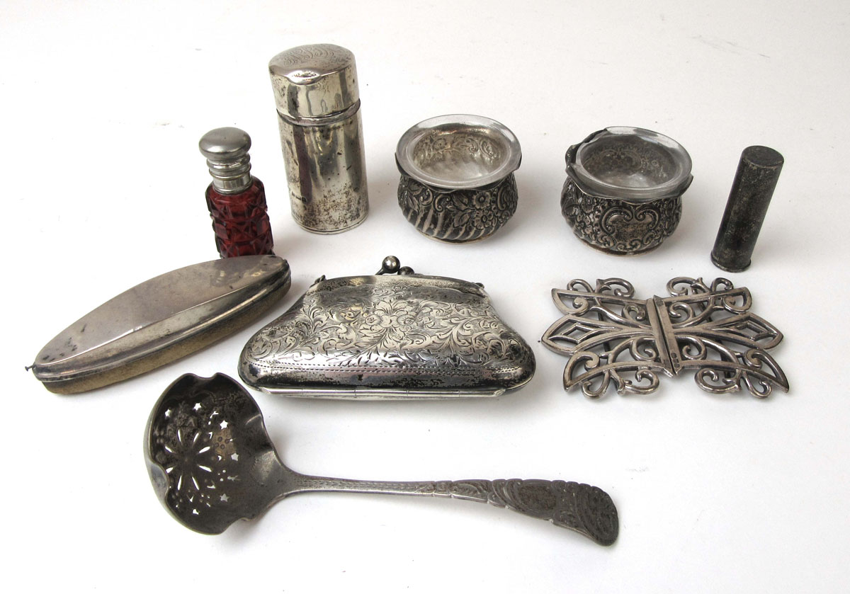 An assortment of silver and white metal items to include scent bottles, salts, nail buffer,