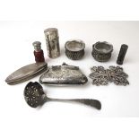 An assortment of silver and white metal items to include scent bottles, salts, nail buffer,