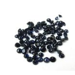 Approximately 23ct of loose round cut blue sapphires.