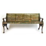 A 19th century cast iron and teak garden bench, the ends with dragon head terminals on monopedia, h.