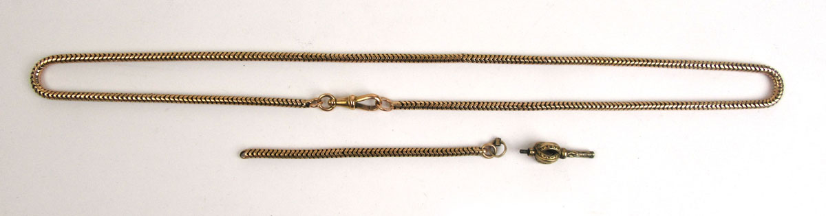 A yellow metal snake-link chain together with one smaller section of chain and a pocket watch key.