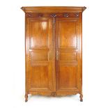 A mid 19th century French oak armoire,