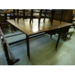 A late 18th century oak drop leaf table