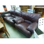 A brown leather two seater settee with matching chair