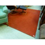 A rectangular red rug