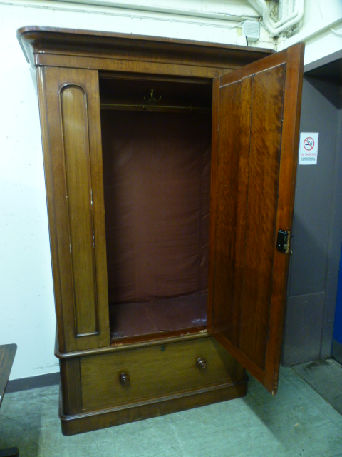 A Victorian mahogany veneered wardrobe having a mirrored bevelled glass centre door with drawer to - Image 2 of 2