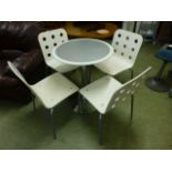 A modern chrome based bistro table with swivel action together with a set of grey metal supported