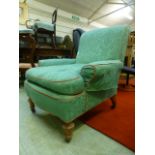 An Edwardian walnut framed green upholstered chair