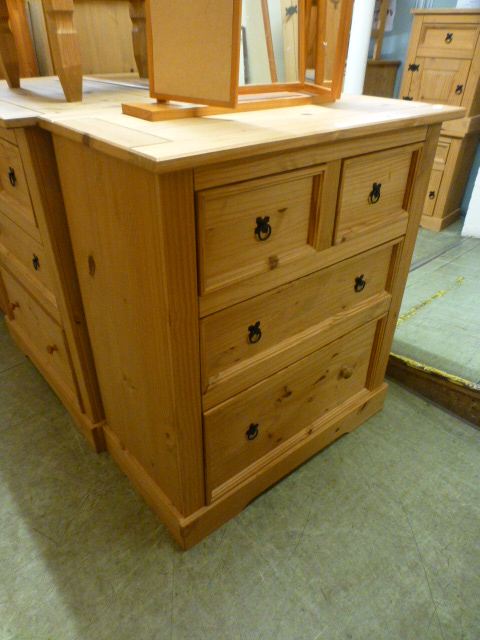 A pine chest of two short over two long drawers