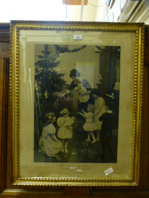 A gilt framed and glazed etching of mother and children titled 'This first Christmas' from the