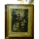 A gilt framed and glazed etching of mother and children titled 'This first Christmas' from the