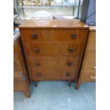 A mid-20th century teak chest of four drawers