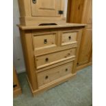 A stripped pine chest of two short over two long drawers