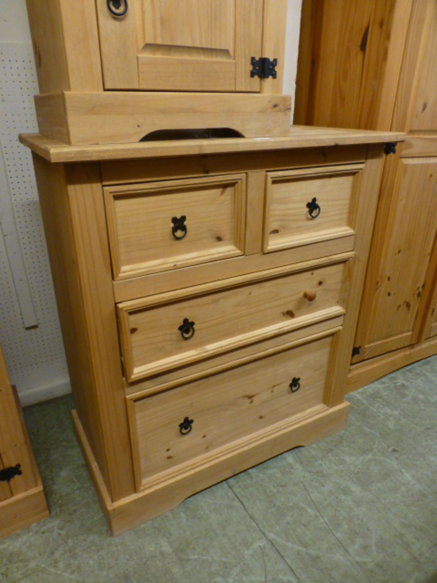 A stripped pine chest of two short over two long drawers