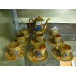 A Japanese tea set comprising of teapot, cream, sugar,