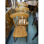 A set of four modern pine dinning chairs