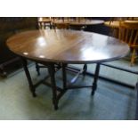 A mid 20th century oak gate leg table