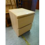 A modern bedside chest of two drawers