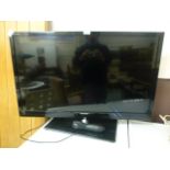 A Toshiba flat screen TV with remote