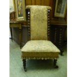 A Victorian rosewood prayer chair with barley twist supports to back upholstered in a cut fabric