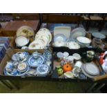 Four trays of decorative ceramic ware to include blue and white