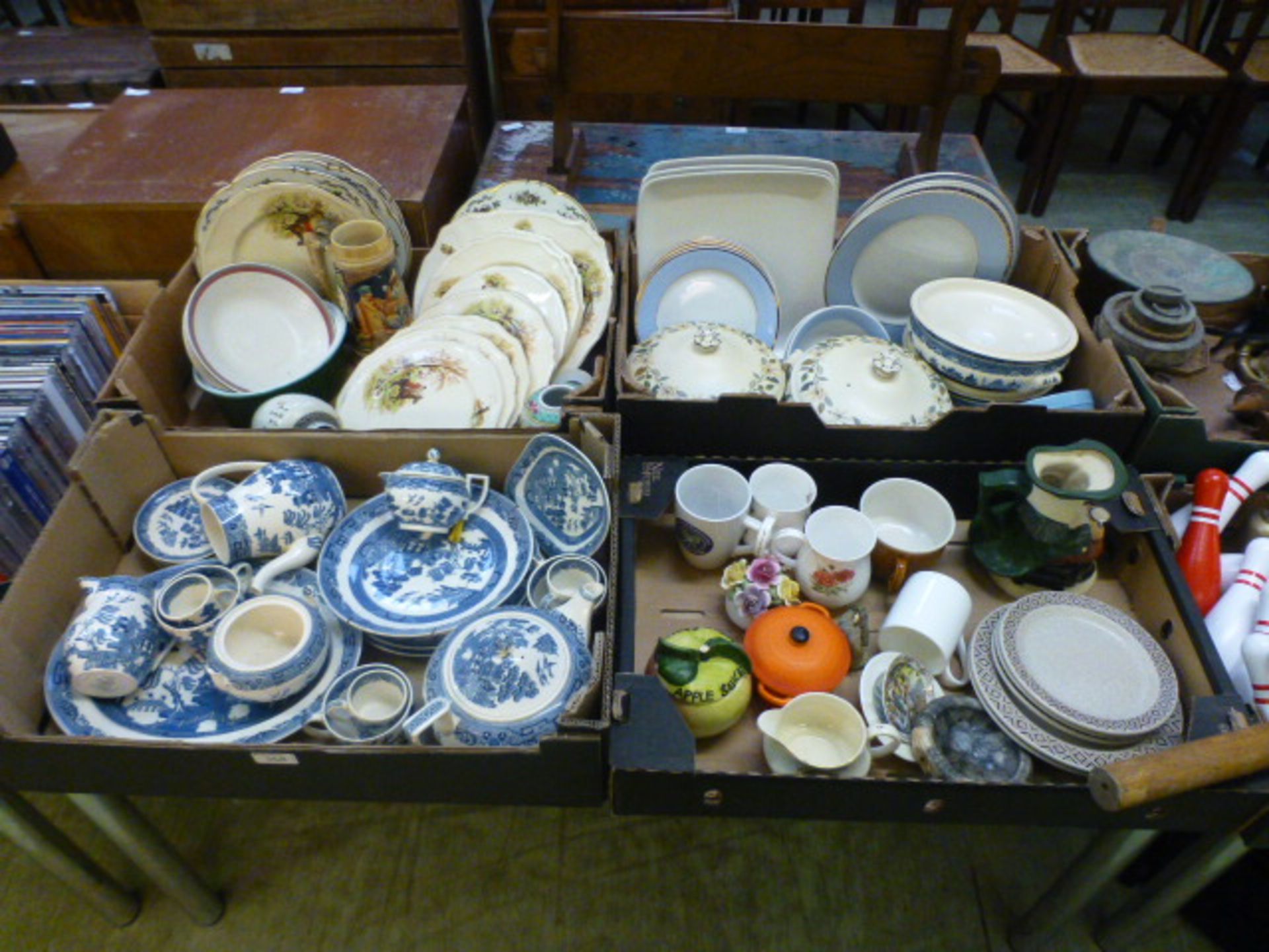 Four trays of decorative ceramic ware to include blue and white