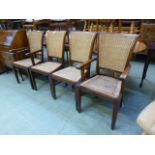 Two standard and two carver Indonesian hardwood dinning chairs with wicker backs and seats