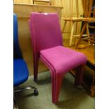 A set of three cerise upholstered chairs