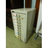 A ten drawer metal stationary cabinet