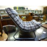 A chrome tubular based 1960s style chair having a checkered brown fabric cushion