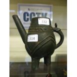 An eastern cast metal teapot