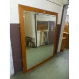 A substantial pine framed beveled glass mirror,