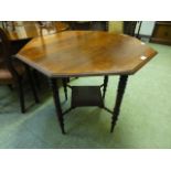 An early 20th century octagonal walnut occasional table with under tier